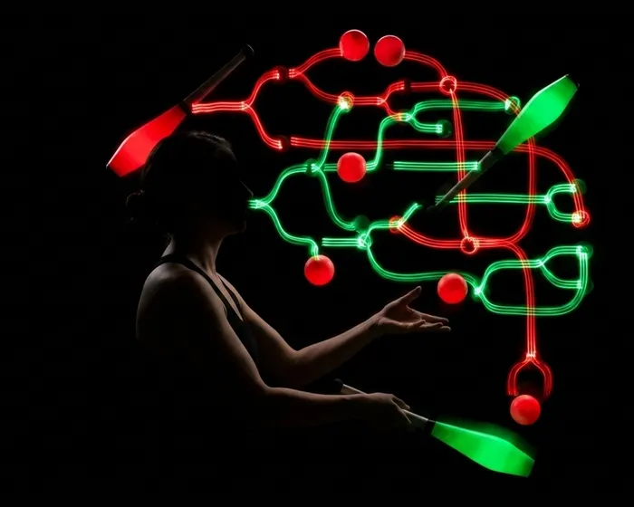 Juggler silhouette with brain circuit overlay and clubs in motion