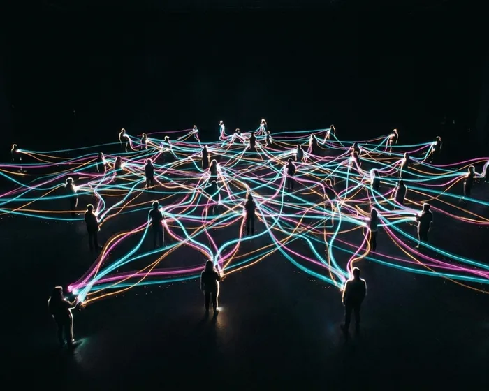 Network of people connected by strings, showing the topology of human systems