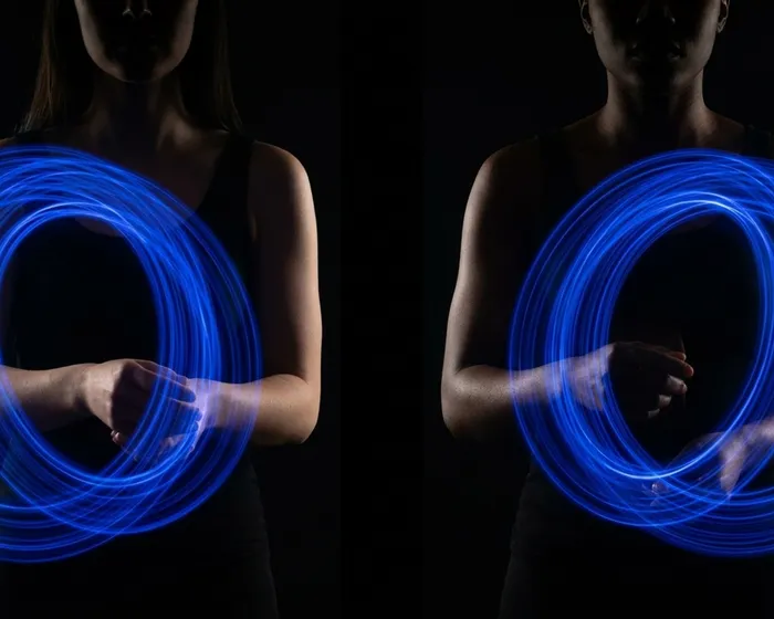 Person with a glowing ring in continuous orbit, light trail showing unbroken circular motion